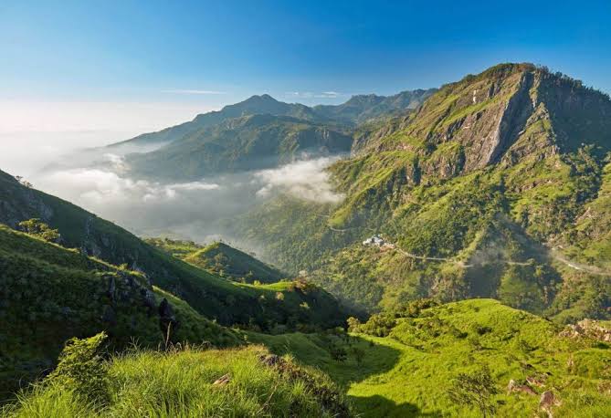 Panoramic vista across the dramatic natural opening of Ella Gap with morning mist in the valley
