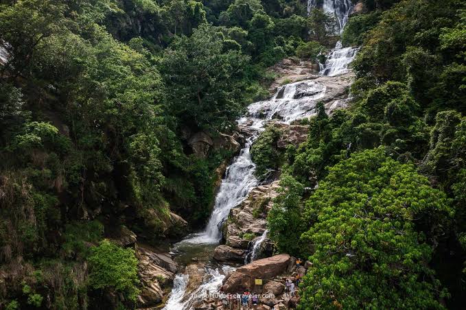 Cascading multi-tiered stream of Ravana Falls rushing over rocks in Ella, Sri Lanka